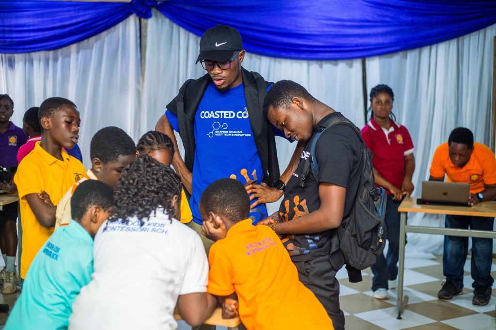 Instructors guiding students through an AI build at STEM Day